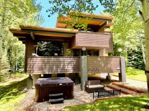 a house with a hot tub in front of it at Aspen West End Sanctuary 4878 sf. in Aspen