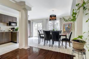 a kitchen and dining room with a table and chairs at Luxury Home In Castlemore Brampton in Brampton