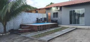 a backyard with a pool and a house at Alter do Chão Casa 02 in Alter do Chao