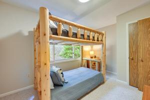 a bedroom with a bunk bed and a window at Stunning Franklin Cabin with Deck and Mountain Views in Franklin