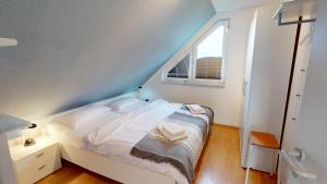 Postel nebo postele na pokoji v ubytování Deich-Residenz App. 6