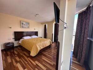 Ένα ή περισσότερα κρεβάτια σε δωμάτιο στο Hotel Inka Palace Huayna Ccapac Cusco