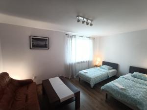 Posteľ alebo postele v izbe v ubytovaní Dom w sercu Gdańska