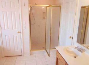 a bathroom with a shower and a sink at House at Clear creek - Just 2 miles to Ft Cavazos , Adventhealth in Killeen