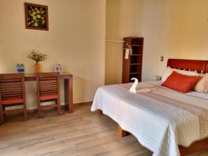 Ein Bett oder Betten in einem Zimmer der Unterkunft Posada El Canto del Cenzontle