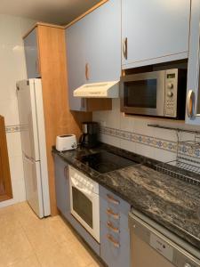 A kitchen or kitchenette at First Line Cabo Roig Orihuela Costa