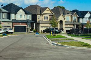 a street in a residential neighborhood with houses at Garden Ave Suite 3 Mins to Hwy 403 in Brantford