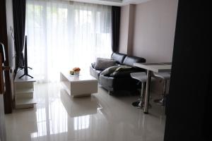 Posezení v ubytování Grand avenue condo Soi Boaukow