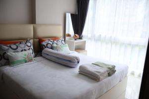 Postel nebo postele na pokoji v ubytování Grand avenue condo Soi Boaukow + 6 fotografií