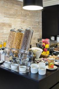 a buffet with many different types of food on a table at Executivo em Hotel - Vila Olímpia in Sao Paulo