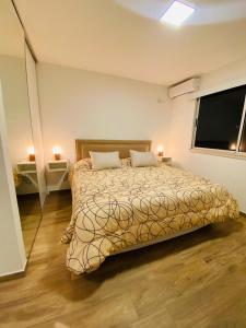 a bedroom with a bed and a large window at NOTRE SOUL in Tigre