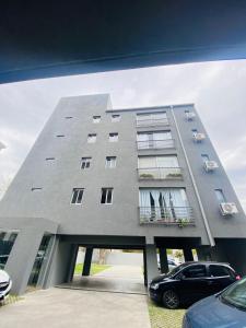 a large building with a car parked in front of it at NOTRE SOUL in Tigre +33 photos