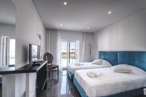 Ένα ή περισσότερα κρεβάτια σε δωμάτιο στο Apartment Ocean Baleal with AC