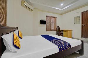 Postelja oz. postelje v sobi nastanitve SPOT ON 81226 Cherai Rest Home