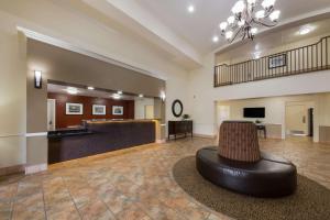 a large lobby with a waiting room and a couch at Best Western Salinas Valley Inn & Suites in Salinas