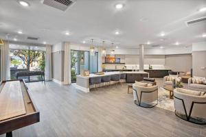 a large living room with a kitchen and a living room at New Jax City Rooftop Pool in Jacksonville