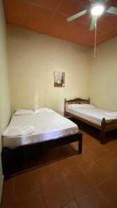 Cama o camas de una habitación en Hostal Casa Bonita Ometepe