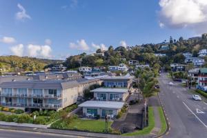 an aerial view of a town with houses at Bayview Motel in Paihia