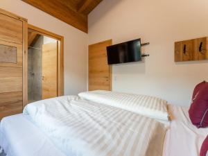 Posteľ alebo postele v izbe v ubytovaní Pinzgau Lodge 2B