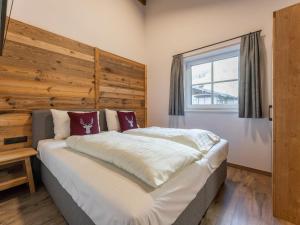Posteľ alebo postele v izbe v ubytovaní Pinzgau Lodge 2B