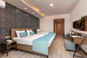Postel nebo postele na pokoji v ubytování Hotella Resort & Spa - All Inclusive