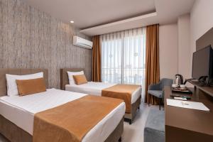 Postel nebo postele na pokoji v ubytování Hotella Resort & Spa - All Inclusive