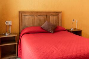 Postel nebo postele na pokoji v ubytování Hotel CasaMia