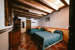 a bedroom with two beds in a room at Hotel CasaMia in Dolores Hidalgo