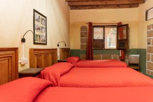 Postel nebo postele na pokoji v ubytování Hotel CasaMia
