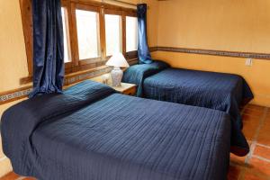 Postel nebo postele na pokoji v ubytování Hotel CasaMia