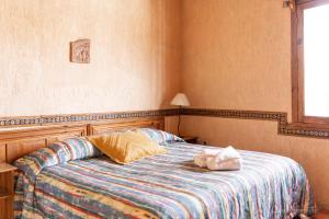 Postel nebo postele na pokoji v ubytování Hotel CasaMia
