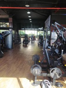 a gym with lots of exercise equipment in a room at @ondinaapartreservas Pé na Areia 441 in Salvador