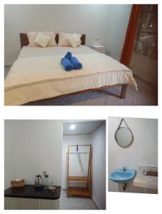 Un dormitorio con una cama con una almohada azul. en Renata Cottages, en Ohoililir
