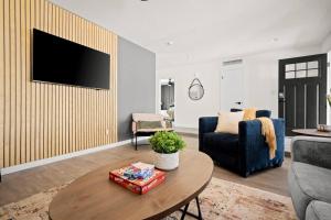 a living room with a couch and a table at Tempe STR/MTR-close to ASU, Old Town & PHX airport in Tempe +29 photos