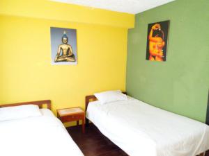 Cama o camas de una habitación en Hostal Inti raymi Backpackers