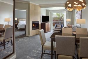 a hotel room with a dining table and a living room at The Westin Trillium House, Blue Mountain in Blue Mountains