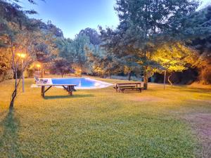 a picnic table and a pool in a park at Beautiful 2-Bed House - Marco de Canaveses in Marco de Canaveses