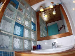 a bathroom with a sink and a mirror at Studio Saint-Chaffrey , 1 pièce, 3 personnes - FR-1-762-11 in Saint-Chaffrey