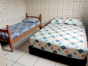 Postel nebo postele na pokoji v ubytování Casa espaçosa com piscina e garagem - Caraguatatuba + 32 fotografií