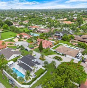 an aerial view of a residential neighborhood with houses at MIA MANSION W/ POOL / BBQ /CABANNA / OUTDOOR BAR in Tamiami