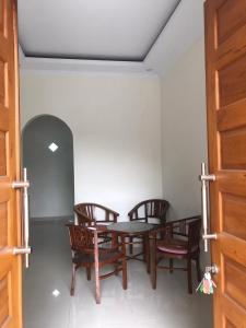 a dining room with a table and chairs at VILLA BUDI HUTAMA in Jetis