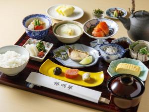 a tray filled with dishes of food on a table at Mars Garden Wood Gotenba in Gotemba