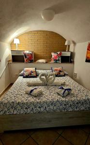 Giường trong phòng chung tại Sweet home Gaeta