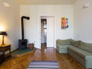 a living room with a couch and a stove at Airy and sunny apartment in the centre of Krakow in Krakow