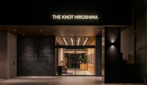 a building with a sign that reads the knotitschka at THE KNOT HIROSHIMA in Hiroshima