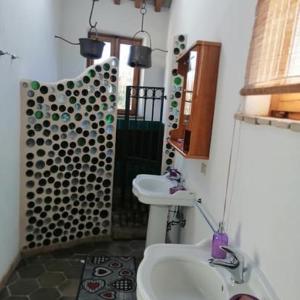 a bathroom with a sink and a toilet at Casa Bosco in San Polo