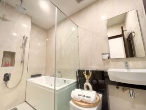 a bathroom with a shower and a toilet and a sink at Paragon Suite Homestay by Antlerzone in Johor Bahru