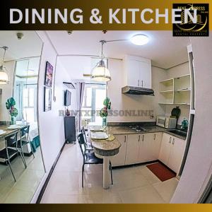 a magazine cover of a kitchen and dining room at FREE SAUNA & POOL ACCESS PLUS 70 PERCENT LESS PROMO This Month Affordable And Cheapest Deluxe Unit In Manila with Balcony x Near NAIA Airport x Manila Bay x Robinsons Place Ermita x Pgh x Bellagio x UP x Intramuros x Updated 2024 Price Staycation in Manila