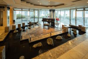 a lobby with a piano and rocks on the floor at Hotel BVLJUA -レジャーホテル- in Kurume