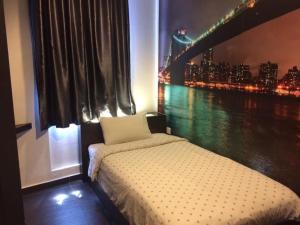 a bedroom with a window with a view of a bridge at Kozi Hotel - Bukit Indah in Johor Bahru